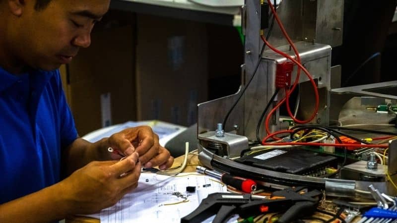 An engineer working on an AGV commissioning project